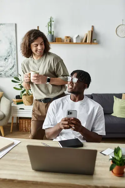 stock image Two partners connect warmly at home, sharing smiles and enjoying their time together.