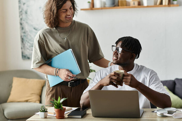 A couple enjoys each other as one shares a warm drink and the other offers support.