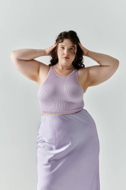 A striking plus size woman showcases her style and confidence in a lavender ensemble. clipart