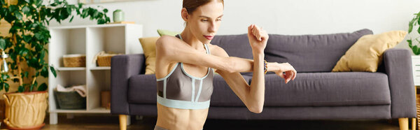 The young woman with anorexia engages in a workout routine at home, showcasing her determination and commitment.