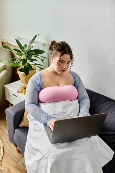 stock image A plus size woman in casual attire enjoys a relaxed day at home.