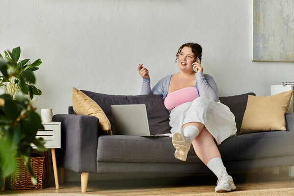 Talkative young woman in cozy homewear enjoys a relaxed day at home.