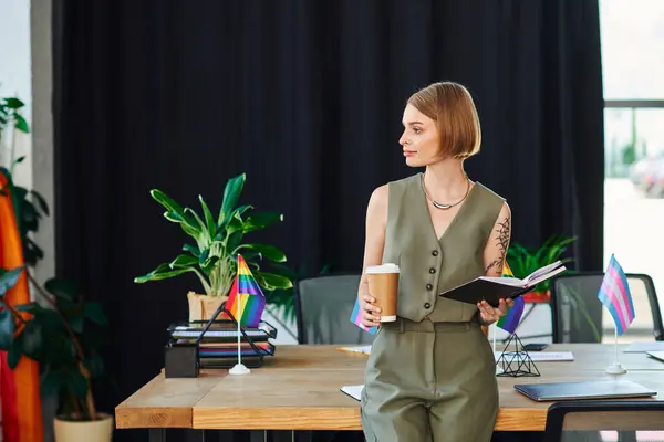 stock image In a vibrant workspace, a woman proudly represents the LGBT community while networking.