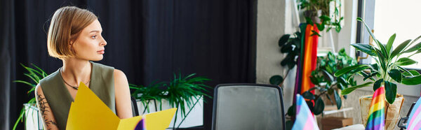 woman gathers in a colorful workspace, engaging in creative discussions and teamwork.