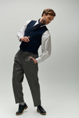 A handsome gentleman showcases his dandy style, embodying elegance and charisma in his pose. clipart