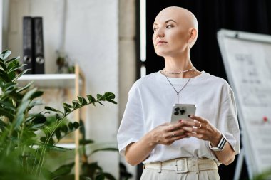 An elegant young bald woman stands confidently, checking her phone surrounded by lush plants. clipart