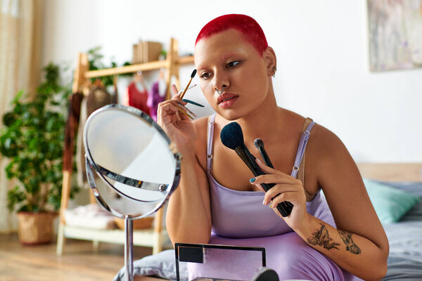 At home, a young woman perfectly applies her makeup while gazing into a mirror, showcasing style.