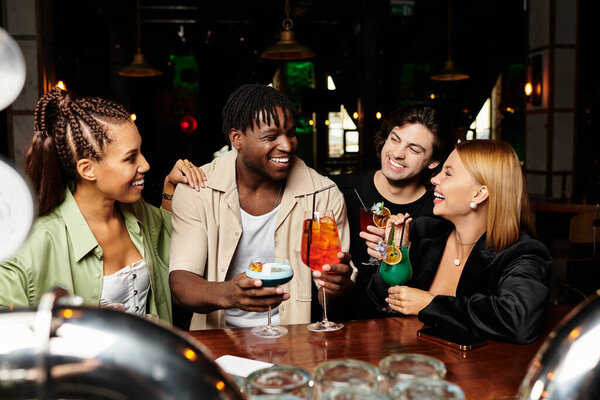 A lively gathering of diverse colleagues engaged in joyous conversation with colorful cocktails.