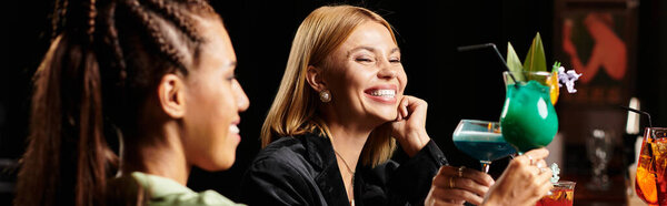 Colleagues celebrate success with vibrant cocktails, sharing laughter and moments of joy together.