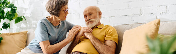 A devoted wife lovingly tends to her husband as they share a quiet moment together at home.