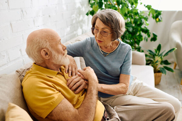 A devoted wife assists her husband with diabetes, showcasing love and support in their cozy home.