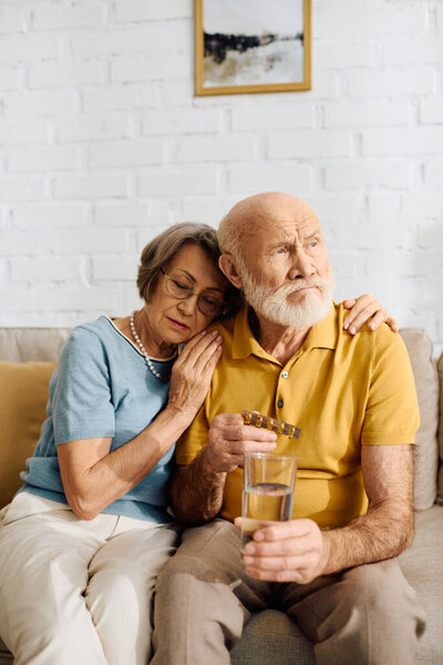 A caring woman comforts her husband with diabetes as they share a quiet moment together.