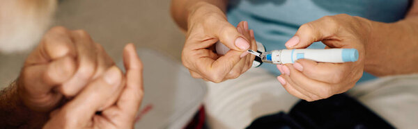 A compassionate wife assists her husband as he manages his diabetes at their cozy home.