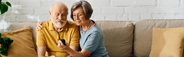 An elderly couple enjoys a tender moment as she assists him with his diabetes management.