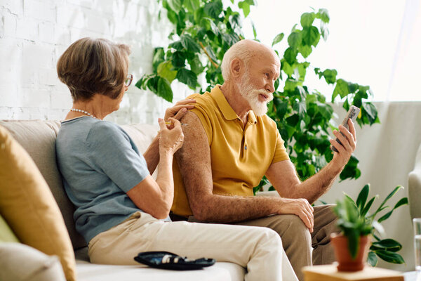 A devoted wife offers support to her husband, managing diabetes, in their cozy home setting.