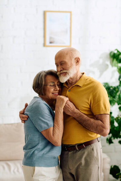 In a cozy home, a caring wife lovingly embraces her husband, managing diabetes together.