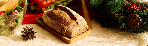 Gourmet loaf of fresh bread on Christmas table.