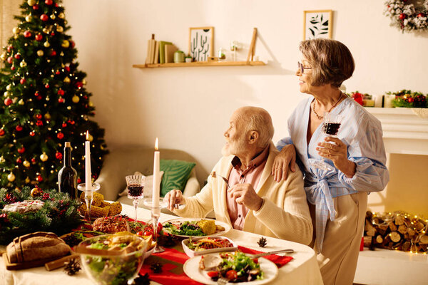 A senior couple celebrates Christmas dinner at home, cherishing love and warmth together.