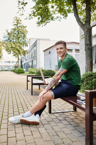 A young man with a prosthetic leg sits on a bench in a bright, welcoming outdoor environment, smiling confidently.