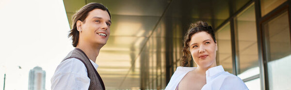 A joyful plus size woman and her male friend share a sunny moment full of positivity.