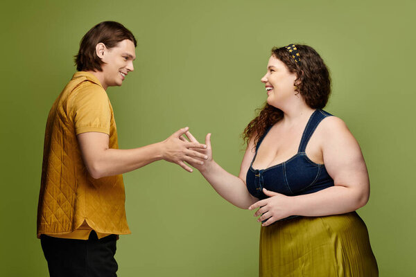 Two friends are enjoying a cheerful interaction, exchanging smiles and gestures.