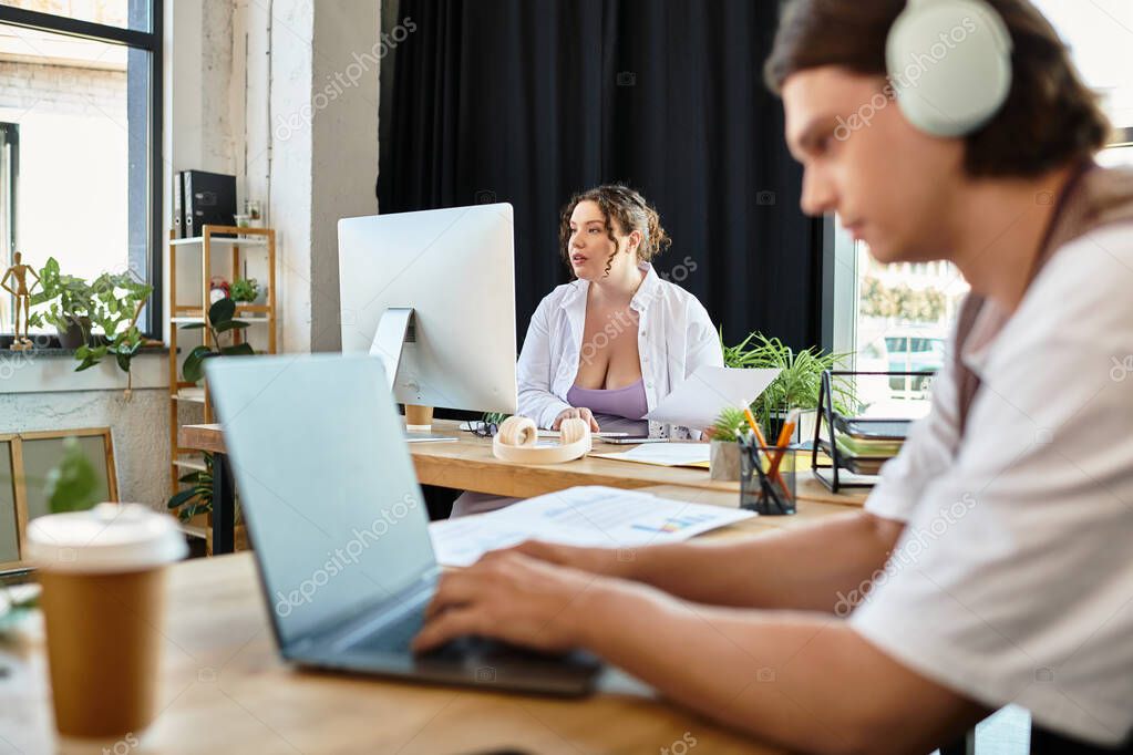 A young plus size woman engages in a collaborative task with her male friend in a cozy workspace.
