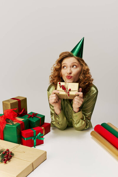 A young woman excitedly posing with vibrant colors, embodying holiday cheer and fun.