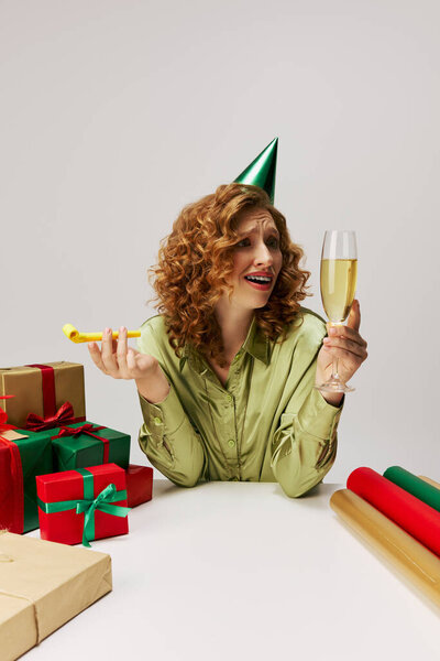 The young woman enjoys a festive atmosphere while celebrating.
