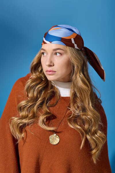 A beautiful plus size woman with long curls and a vibrant scarf gazes thoughtfully at the camera.