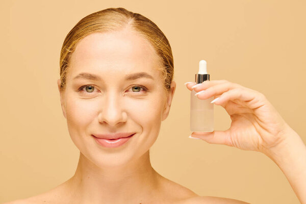 A cheerful plus size woman holds a skincare serum, highlighting her natural beauty and confidence.