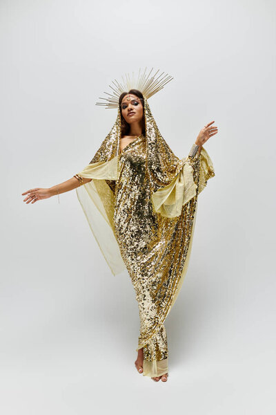 A breathtaking African American goddess captivates in a golden dress, exuding grace and glamour in a serene studio.