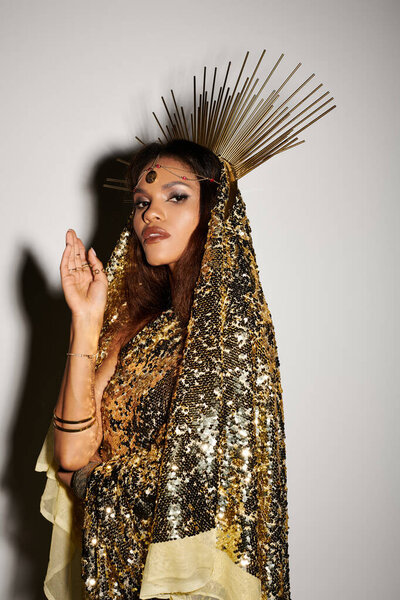 A breathtaking African American goddess shines in a shimmering golden dress, exuding confidence and grace.