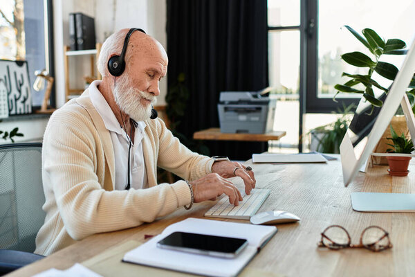 A skilled businessman in smart casual attire works diligently at his desk, wearing headphones and focused on tasks.