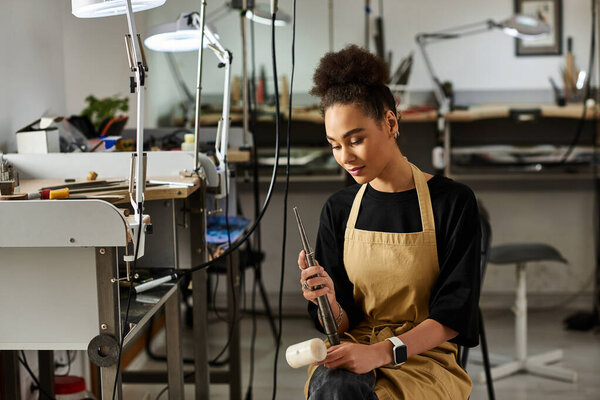 Skilled craftswoman focused on designing elegant jewels in her creative workspace.