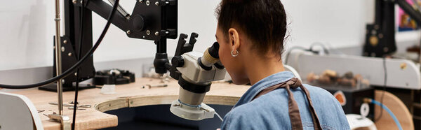 The artisan meticulously crafts intricate jewels in a bright and focused workspace.