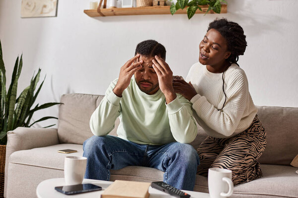 couple enjoys their time together at home in cozy sweaters, sharing love and support.