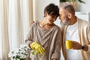 Couple shares a joyful experience while tending to plants and enjoying each others company. clipart