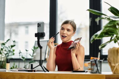 Young influencer excitedly demonstrates beauty products while connecting with her audience online. clipart