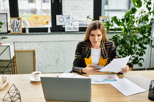 Focused businesswoman analyzes reports and manages tasks in a contemporary workspace.