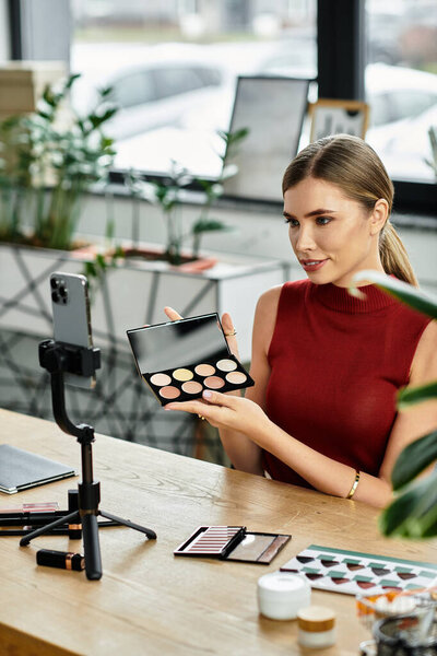 Young woman captivates her audience while showcasing makeup online in a trendy setting.