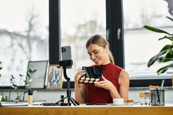 Молодая женщина с волнением делится своими любимыми косметическими продуктами во время прямой трансляции.