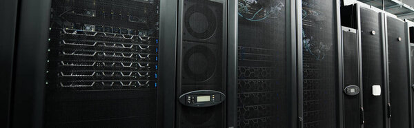 High-tech server room filled with servers, emphasising modern design and digital security measures, banner