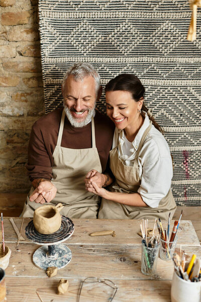 A beautiful couple engages in a pottery class, creating art and sharing laughter as they mold clay.