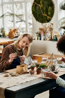 Friends gather at a vibrant workshop to craft beautiful succulent arrangements together. clipart