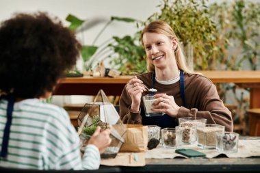 Participants enjoy crafting unique terrariums filled with succulents and friendship in a workshop. clipart