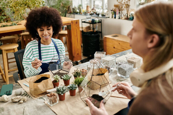 Two friends enjoy a lively succulent workshop, creating artistic mini gardens filled with joy.
