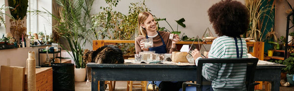 Participants joyfully engage in a hands on workshop centered on succulents and plants.
