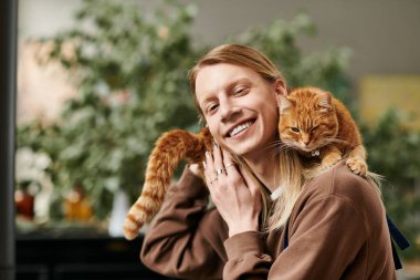 Participant enjoy a vibrant succulent workshop with a cat amidst greenery. clipart