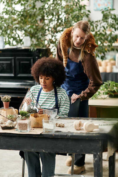 Two friends enjoy a lively workshop surrounded by thriving plants and succulents, cultivating bonds.