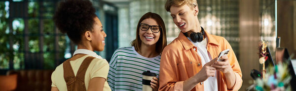 Three colleagues laugh and chat happily in the hotel lobby, enjoying their time.